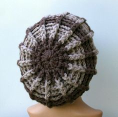 a crocheted hat on top of a mannequin head