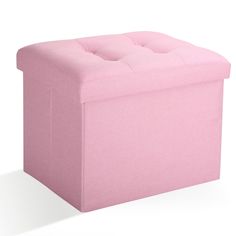 a pink ottoman with buttons on it