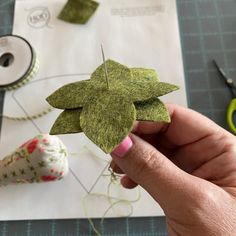 someone is making something out of felt with scissors