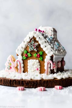 a gingerbread house is decorated with candy canes