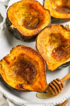 baked acorns with honey on a white plate