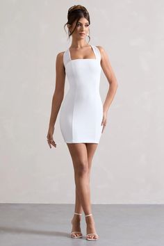 In need of a go to mini? Soul is the perfect new season staple to add to your wardrobe. This little white mini is carefully cut in our premium stretch jersey to fit you like a glove. With a self-tie halter neck, pair this style with a sleek updo to show it off.  Features  - Premium stretch jersey - Bodycon fit  - Self-tie halter neck - Sleeveless  - Invisible zip closure - Mini length   Sizing & Fit  Model is 5'7 and wears UK size 8 / US size 4  Product Information     Double layered with good stretch Premium jersey in White (95% Polyester, 5% Elastane)  85cm total length  SKU: CL131076005 Sleek Updo, Velvet Prom Dress, Black Dress Prom, White Bodycon, Black Tie Gala, Party Dress Long Sleeve, Bridesmaid Outfit, Black Sequin Dress, Black Velvet Dress