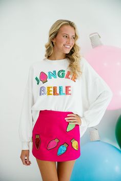 Get ready for the holidays with our Jingle Belle white pullover! - The playful white pullover features vibrant rainbow sequin Jingle Belle letters for a fun and festive touch. - A pink Christmas light patch adds an extra quirky detail to this must-have holiday essential. All orders are currently shipping within 14 business days. To receive item quicker, expedited shipping is available at checkout. **All Christmas orders must be placed with expedited shipping to guarantee delivery by Dec. 24 if p Xmas Fits, Trash Aesthetic, Pink Christmas Lights, Initial Sweatshirt, Light Pink Skirt, Outstanding Outfits, Disney 2023, A Pink Christmas, Rivers Edge