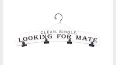 a sign that says, clean single looking for mate hanging on a clothes hanger