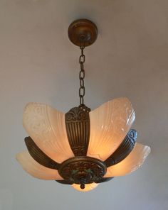 a chandelier hanging from the ceiling in a room