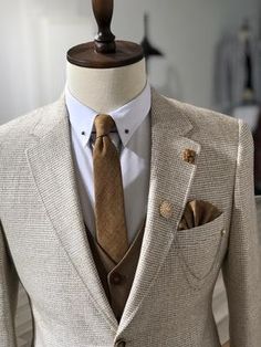 a mannequin with a suit and tie on it's lapel stand