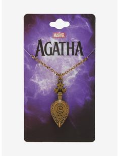 a necklace with the word agathha on it and an image of a heart shaped pendant