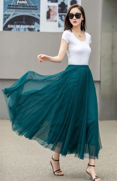 "This blue tulle swing skirt is perfect for any occasion! The lightweight fabric flows beautifully, and the pleated design adds a playful touch. Whether you dress it up for a night out or keep it casual with sandals, this skirt is sure to become a go-to in your wardrobe. DETAILS: * Tulle Skirt * No Pockets * Around elastic waistband * Circle Skirt * Big swing skirt * Perfect for spring, summer * Suit vacation, beach, dance etc. * Machine Washable in Warm/Cold Water; Do not bleach / Mid-iron / Hang Dry *The model is 170 cm (5′7″) tall with a 80 cm (31.5\") bust, 66 cm (26\") waist. She is wearing the skirt in size XS. * Choose CUSTOM Order if you Can't find your size in our size Chart Chang the Length Your Height is not Between 5'1\" - 5\"9\" Your weight is not Between 47 kg - 75 kg SIZE GU Green Tulle Skirt, Green Tulle, Tulle Midi Skirt, Skirt Summer, Blue Tulle, Wool Clothing, Dance Skirt, Blue Beach, Skirt Long