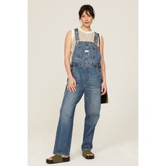 Blue denim (100% Cotton). Overalls. Pull on. 29" inseam. Imported. High Rise Washed Denim Jumpsuit, Casual Dark Wash Mid-rise Denim Jumpsuit, Casual Mid-rise Dark Wash Denim Jumpsuit, Blue Utility Jeans For Everyday, Medium Wash Denim Jumpsuit For Work, Workwear Medium Wash Denim Jumpsuit, Everyday Medium Wash Denim Jumpsuit, High Rise Washed Blue Denim Jumpsuit, Washed Blue High Rise Denim Jumpsuit