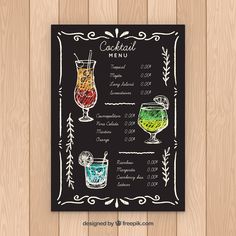 a chalkboard menu for cocktails with drinks in glasses on wooden table top, front view