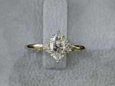 an engagement ring with three diamonds on it