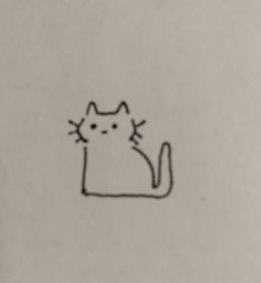 a drawing of a cat sitting on top of a piece of paper