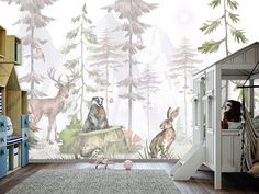 a child's room with animals and trees on the wall