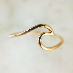 An ocean wave symbolizing power and strength. It makes for a beautiful stand-alone ring, as well as adds a lot of character to any ring stack. Finish: Hammered Metal: 14K Yellow, White or Rose Gold & Sterling Silver White Opal Earrings, Gold Bar Earrings, Sapphire Wedding Band, Unique Bands, Flower Engagement Ring, Bar Stud Earrings, Wave Ring, Gold Ring Sets, Ocean Wave