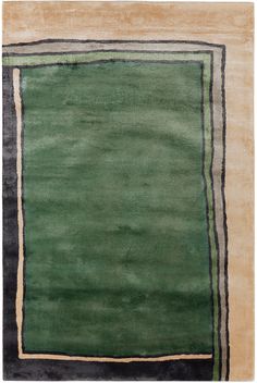 an area rug with green and black stripes on the border, in front of a white background