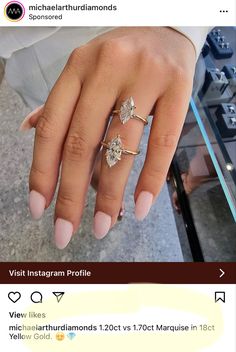 a woman's hand with three diamond rings on her left and the other hand holding an engagement ring