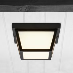 This tapered flush mount LED porch ceiling light is the perfect finishing touch for the front entrance or other exterior area of any house, apartment or condo. It features a durable black steel housing with an acrylic lens, suitable for standard outdoor porch light applications. This decorative integrated LED fixture is designed to complement a wide range of architectural styles. It produces 1000 lumens of 3000K warm white light. It is equivalent to a 75W incandescent bulb while using only 12.5 Porch Ceiling Lights, Lighting Makeover, Outdoor Porch Lights, Car Porch, Porch Ceiling, Porch Light, House Apartment, Flush Mount Light, Warm White Light