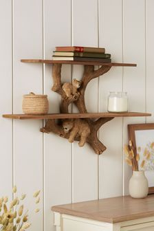 two wooden shelves on the wall with books and vases next to eachother