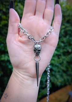 Gothic skull and long spike chain necklace 💀 This necklace is made of 100% stainless steel so is completely waterproof and won't tarnish or discolour! Available in various sizes: Small (shown in photographs) Measures 16 inches and comes with a 2.5 inch extension chain  Medium  Measures 18 inches and comes with a 2.5 inch extension chain  Large  Measures 20 inches and comes with a 2.5 inch extension chain  Please don't hesitate to contact me with any queries or suggestions 😊 Comes gift wrapped Gothic Skull, Pendant Necklaces, Halloween Shopping, Favorite Jewelry, Necklace Etsy, Jewelry Necklace Pendant, Chain Necklace, Jewelry Necklaces, Accessory Gift