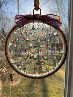 a stained glass ornament hanging from a window