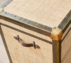 an old trunk with metal rivets and leather handles is shown in this image