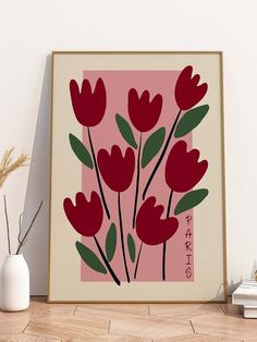 a painting with red flowers on a pink background