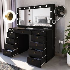 a black vanity with drawers and a mirror on the wall next to a potted plant