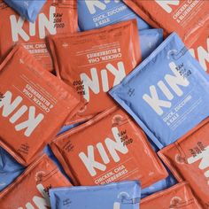 many packets of knik are stacked on top of each other in blue and orange