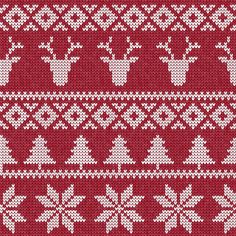 a red and white knitted pattern with deers