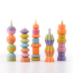 a group of colorful candles sitting next to each other