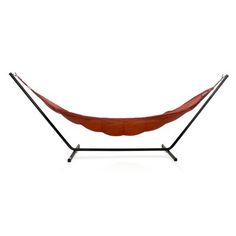 a red hammock hanging from a metal stand