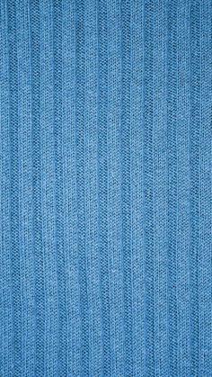 a blue fabric textured background that looks like it has been woven into something else