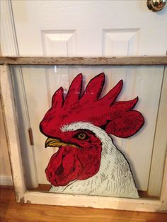 a rooster head is painted on the front door