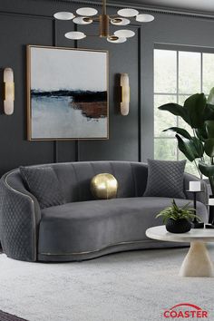 a living room with grey couches and gold accents