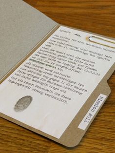 a close up of a piece of paper with a fingerprint on the inside of it