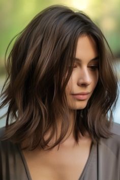 For a timeless aesthetic, consider elegant waterfall layers. These long layers flow effortlessly, giving your medium-length hair a waterfall effect. Click here to check out more stunning medium-length layered haircuts trending right now. Medium Length Hair With Layers, Trending Haircuts, Layered Haircuts