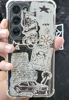 a person holding up a cell phone case that has drawings on the front and sides