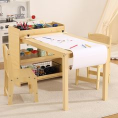 a child's table and chair set up in a playroom