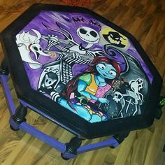 a stool that has been painted with skeletons and jack skellings on the side