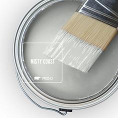 a paint can with a brush in it and the words silver city painted on it