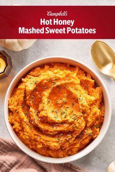 a bowl filled with mashed sweet potatoes on top of a table