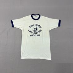 Medium / 1970s Cross Country Canoe Marathon Track Wascott, WI Minimalist Two Tone Sheer Blue/White T Shirt Pit to Pit: 17in Top Collar to Bottom: 26in Imperfections throughout, check photos before purchasing! ITEM IS SECONDHAND! Please take the time to review our shop policies listed on our homepage before purchasing. We do NOT accept returns, but will gladly accept exchanges. All items are vintage, and sold AS IS. Thank you for shopping with us! - RatRunners Vintage Running, Navy Crewneck, Running Track, Vintage Mens Fashion, Old Shirts, Grey Crewneck, Surf Style, Vintage Apparel, Cross Country