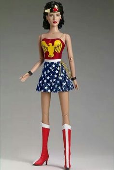 a barbie doll wearing a patriotic outfit and red high heeled boots with an eagle on her chest