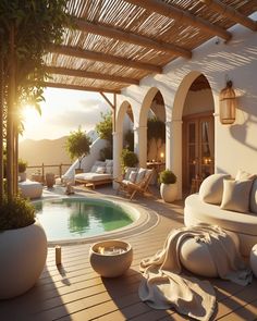 the sun is shining on an outdoor patio with a swimming pool and lounge chairs around it