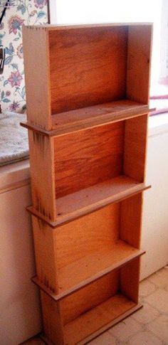 a wooden shelf sitting next to a window