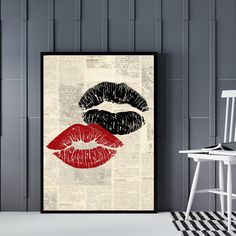 two lips on an old book page with black and red lipstick