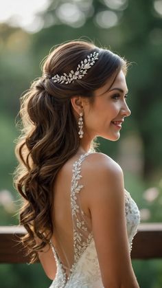 a woman with long hair wearing a wedding dress and earrings on her head, looking off to the side