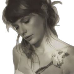 black and white photograph of a woman with flowers in her hair