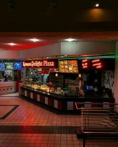 the inside of a fast food restaurant with neon lights