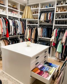 the closet is full of clothes and shoes for all kinds of people to choose from